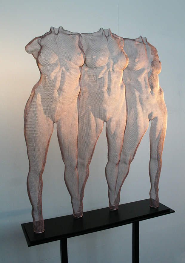 Three female figures as a sculpture composition, wire-mesh art